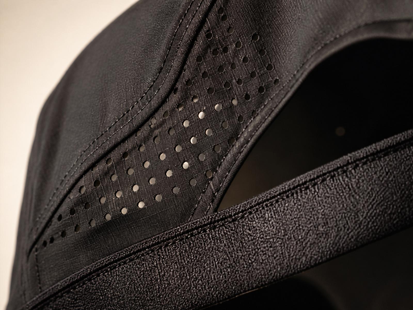 Macro view of perforated performance shell and sweatband